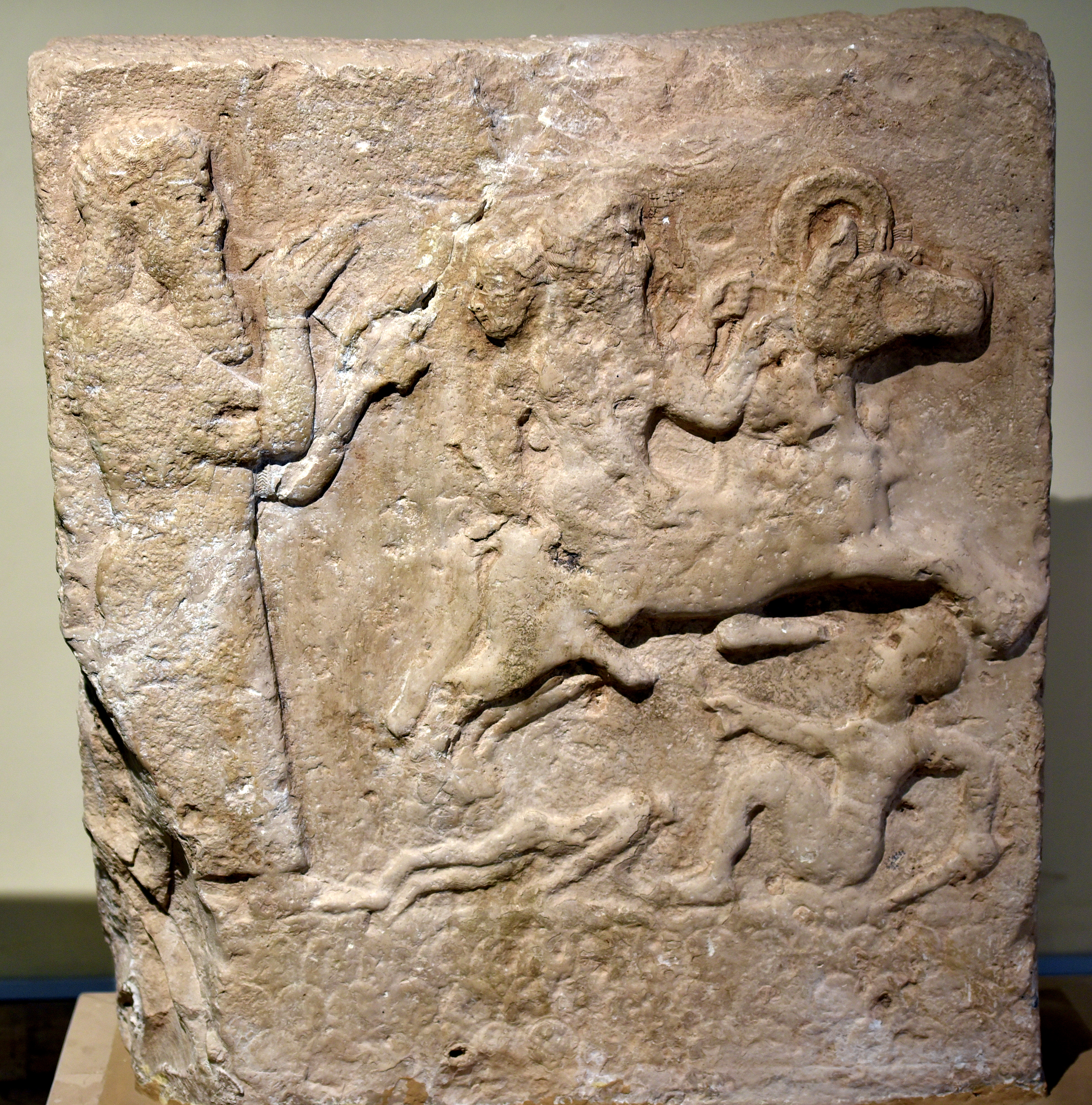 FileAssyrian_wall_relief_showing_a_scribe_and_a_horseman_trampling_enemies._From_Anah_Iraq._Iraq_Museum.jpg
