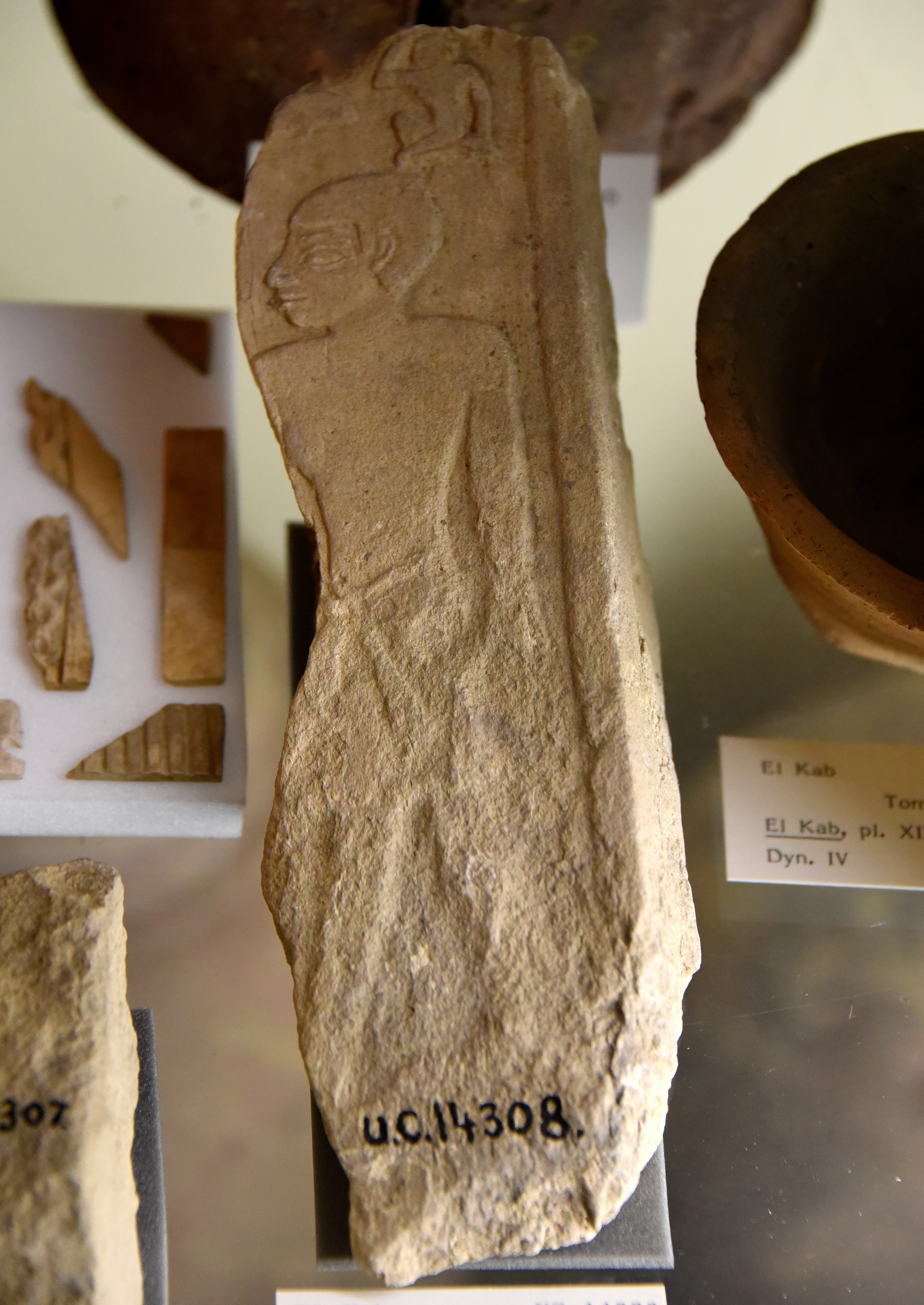 FileFragment_of_a_relief_block_or_stela._Standing_male_figure_below_hieroglyphs._Limestone._4th_Dynasty._From_the_mastaba_of_Kameni_Ka-Mena_at_El_Kab_Nekheb_Egypt._The_Petrie_Museum_of_Egyptian_Archaeology_London.jpg