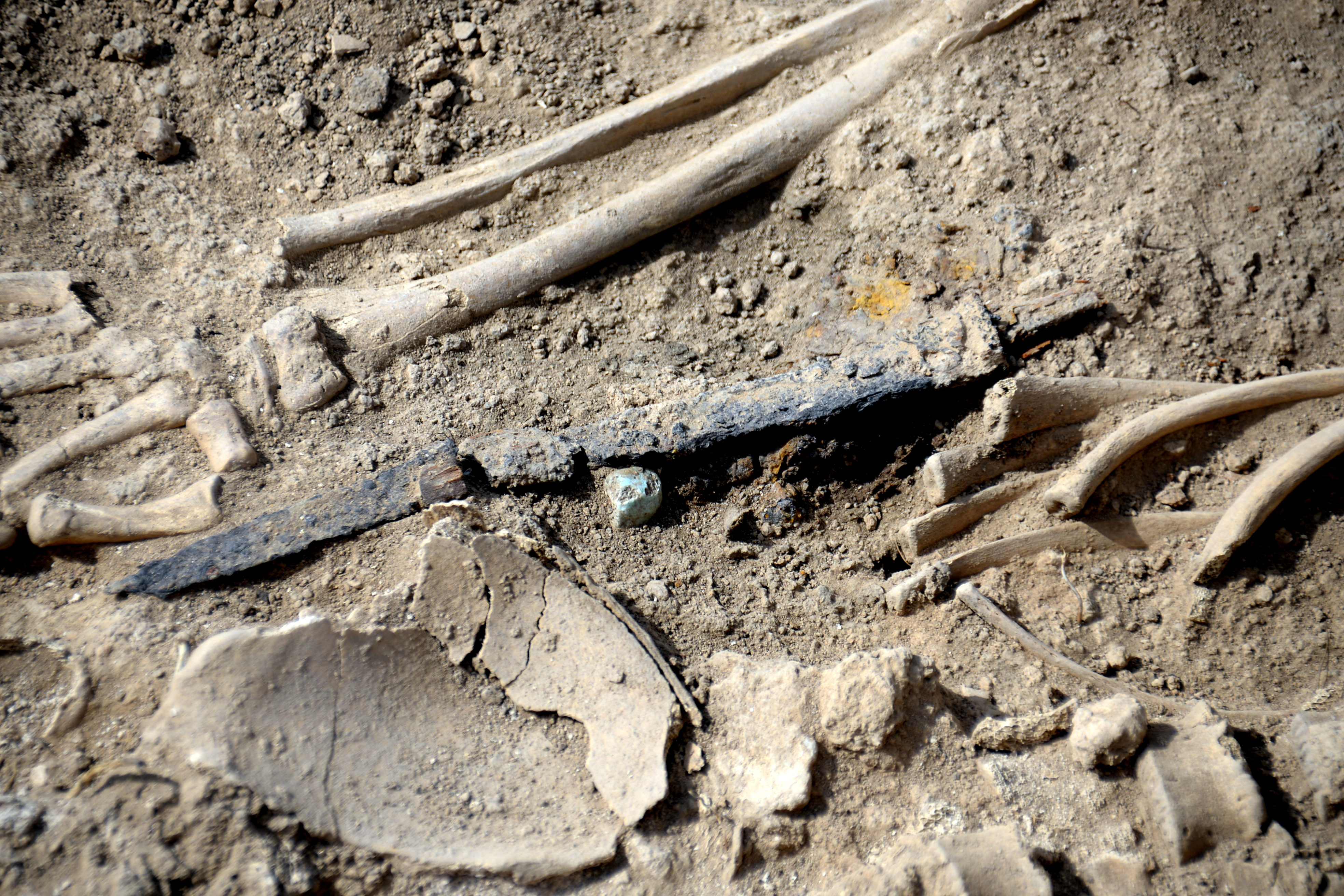 FileA_dagger_a_turquoise_piece_and_a_skeleton._Excavations_at_Tell_Kunara_Akkadian-Lullubian_2300-2000_BCE._Sulaymaniyah_Governorate_Iraq.jpg